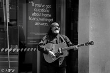 Singing for God in Queen Street by the Anz bank, 'If you've got the questions...' He might have the answer